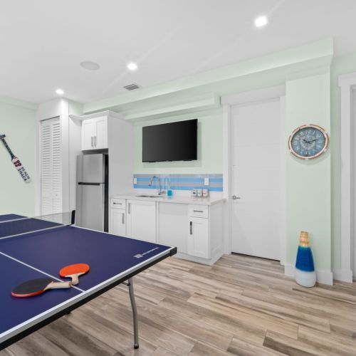 Watching  favorite show on the tv in the shack while playing ping pong. Multitasking at its finest!