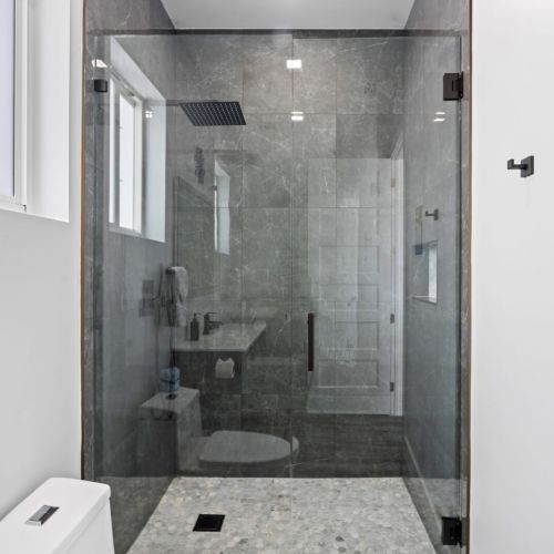 The inviting ensuite bathroom comes with a contemporary walk-in shower.