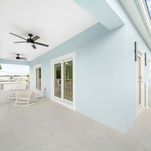 Relax on the spacious porch with stunning views and gentle ocean breezes.
