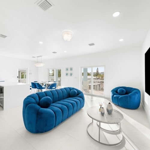 Bright and airy space with vibrant blue furnishings and modern elegance!