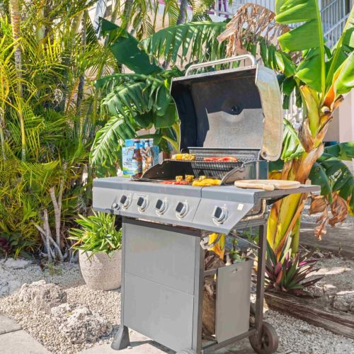 Sizzling up the best moments under the open sky! Imagine enjoying delicious grilled delights surrounded by nature. Your perfect getaway awaits with a cozy vibe and lush greenery. Come gather 'round for tasty bites and unforgettable memories!