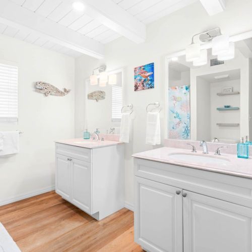 Our charming bathroom is designed for relaxation, featuring a sleek mirror and a comfy sink. Whether you're freshening up or winding down after a day of adventure, this space is your perfect retreat.
