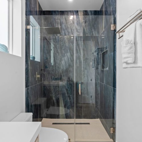 Each bathroom is fully stocked with essential toiletries and fresh towels.