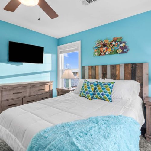 Enjoy vibrant turquoise walls, serene decor, and stunning marina vistas!