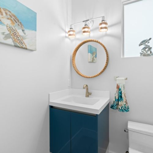 Modern fixtures and stylish décor make the bathrooms a serene escape.