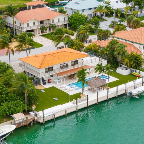 Waterfront paradise with private dock, heated pool and endless canal views. Perfect launch point for boat days.