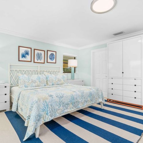 Primary king bedroom with plenty of space, natural light and a calm coastal feel.