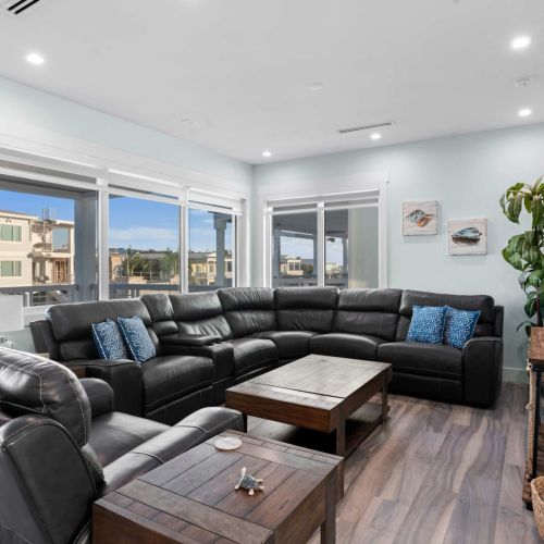 This inviting space is all about relaxation, whether you’re sinking into the sofa with a good book or hosting friends for a movie night. Make yourself at home!