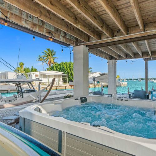 Immerse yourself in luxury with a bubbling hot tub and stunning water views!