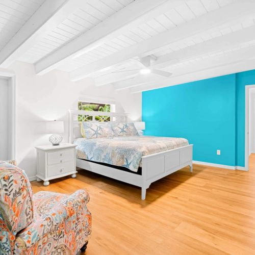 Welcome to your cozy sanctuary! This bedroom is the perfect blend of comfort and style, featuring a plush bed and a stylish chair for those moments when you just want to relax with a good book. Your getaway starts here, where sweet dreams await!