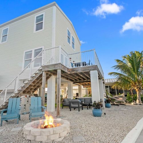 Gather around the fire pit after a day of adventures, amidst tropical vibes!