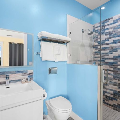 Our chic bathroom features a stunning glass shower, perfect for unwinding after a day of adventure.