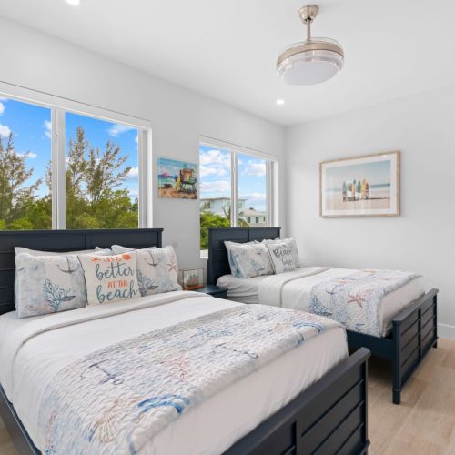 Upgrade your bedroom setup with dual beds and a flat screen tv for the perfect blend of comfort and entertainment! 🌟🛋️