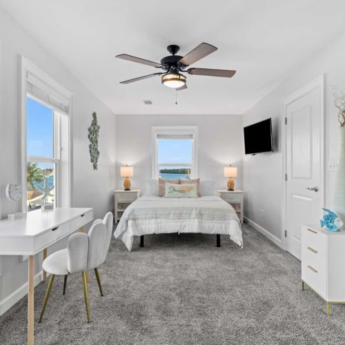 Bright vistas and stylish decor await in this beachside retreat with a peaceful desk.