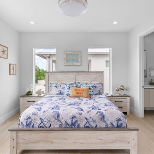 Elevate your bedroom setup with a perfectly made bed and a modern flat screen tv. The ultimate relaxation zone awaits!