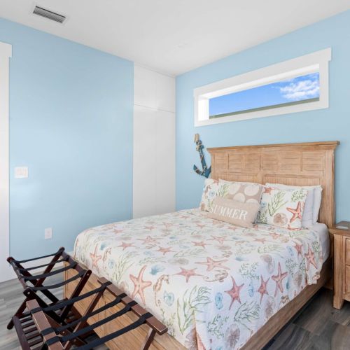 Cozy up in this stylish bedroom where relaxation meets entertainment.