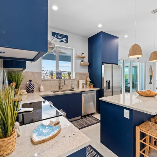 The kitchen island offers a fantastic dining setting for a homemade meal.