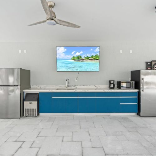 Stay in touch with the living room crowd by relaxing at the bar.