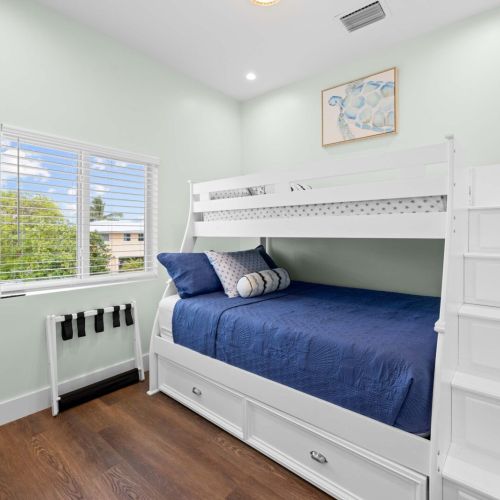 Bunk room: a twin-over-full bunk with built-in stairs, ready for the kids.
