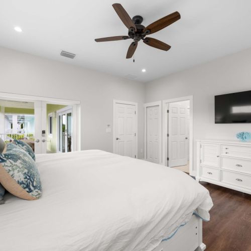 Primary suite: wake up and step straight onto the balcony overlooking the water.