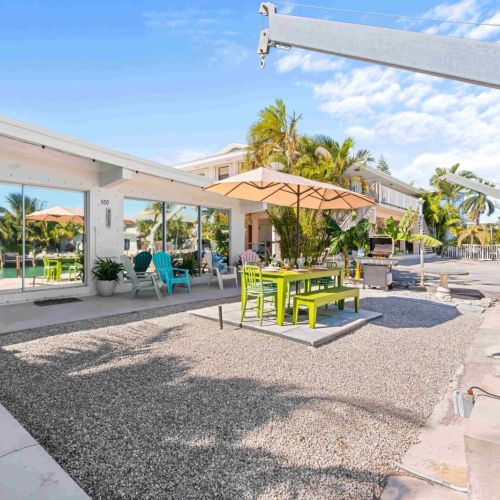 Relax and unwind on our charming patio! With cozy tables and chairs under the shade of trees, it's the perfect spot for enjoying your morning coffee or sharing stories with friends. Come make unforgettable memories in this serene outdoor oasis!