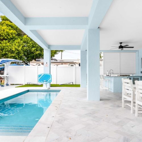 Morning dips, afternoon meals, and long conversations flow effortlessly here. The covered poolside lounge was built for slow days that stretch into golden evenings, where every moment feels like vacation time well spent.