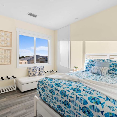 This charming bedroom is your ideal escape, complete with a plush bed, soft linens, and a lovely window that invites the sunshine in.