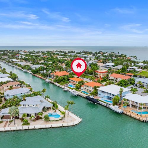 Aerial view of deep blue on a prime canal. Minutes to open water and everything the keys offers.
