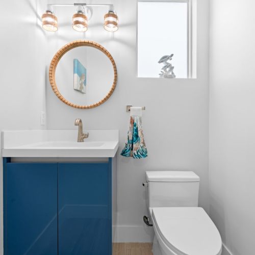 There’s no need to go to the bedrooms since the convenient half bath is accessible from the living room.