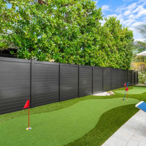 Your private putting green, perfectly tucked between the palms. Practice your short game in the shade, lounge nearby by the pool, and enjoy a backyard that turns relaxation into a sport.