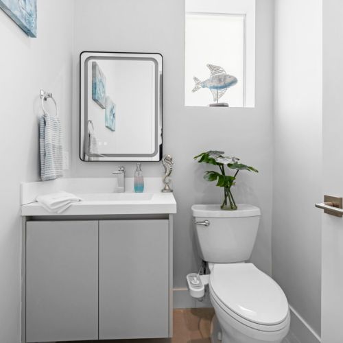 The half bath is accessible from the living area for added convenience.