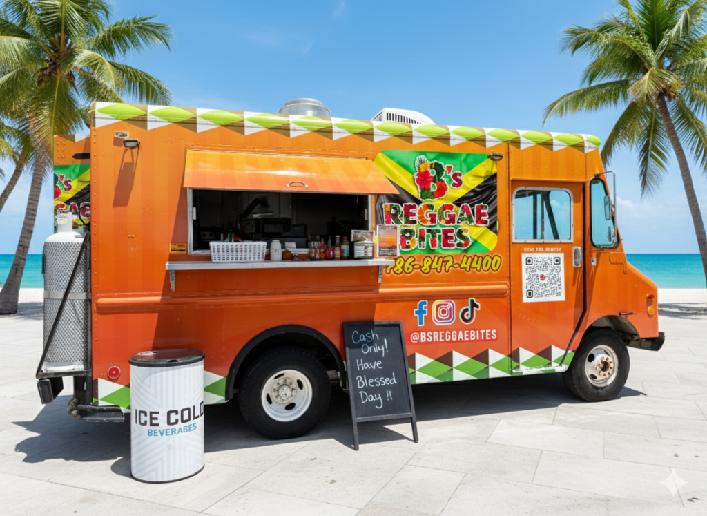 An orange reggae-themed food truck is parked by the beach with palm trees and blue ocean in the background. A sign reads cash only! Have a blessed day!! And a bin labeled ice cold beverages stands nearby.